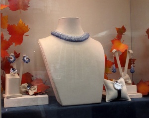Love the necklace and the swirl earrings at far left.