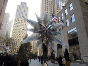 Swarovski crystal tree topper. Behind and to the left is the Rockefeller Center tree, topped by another Swarovski crystall doodah.